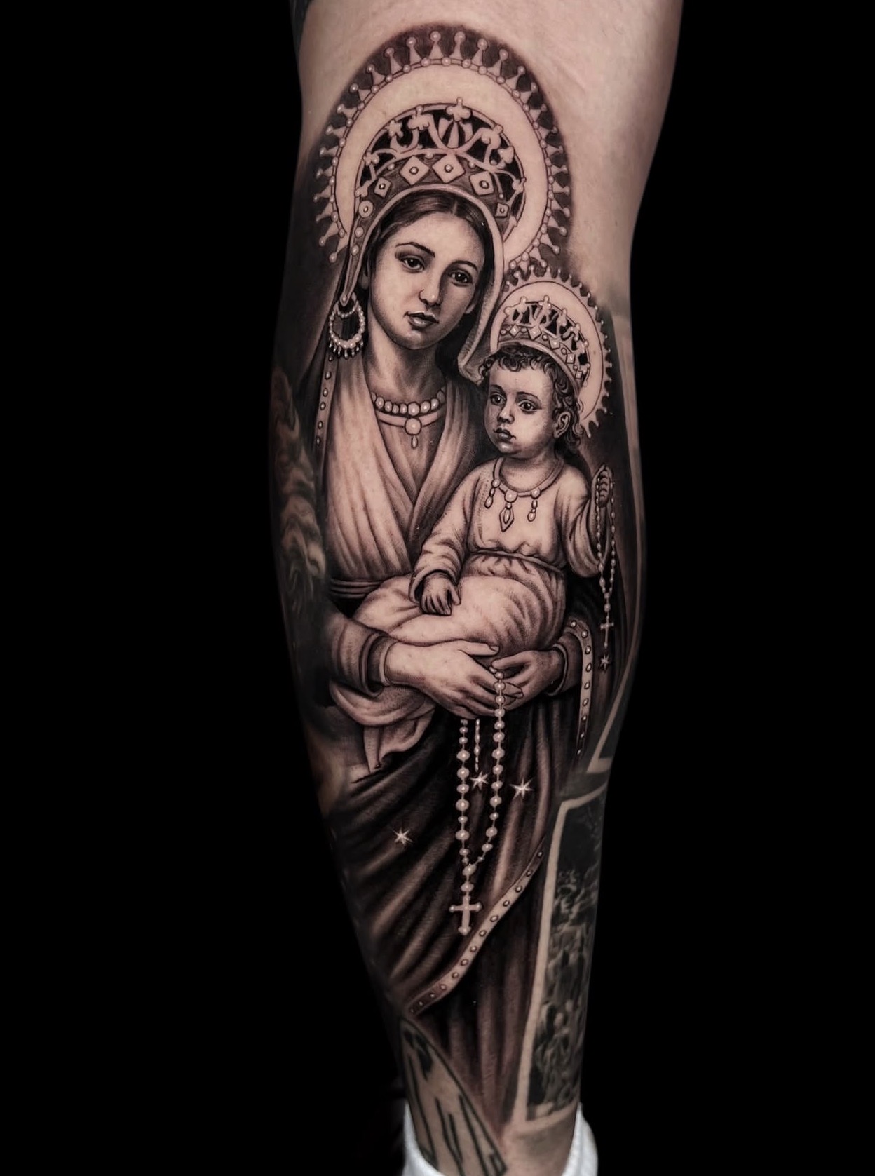 Black and grey Madonna and child religious realism tattoo